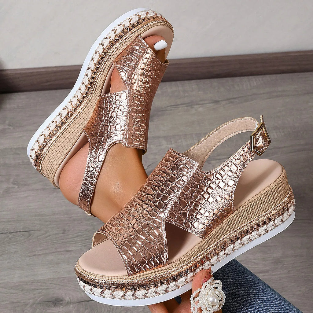 Gold women's Roman sandals with round toe and adjustable ankle buckle.