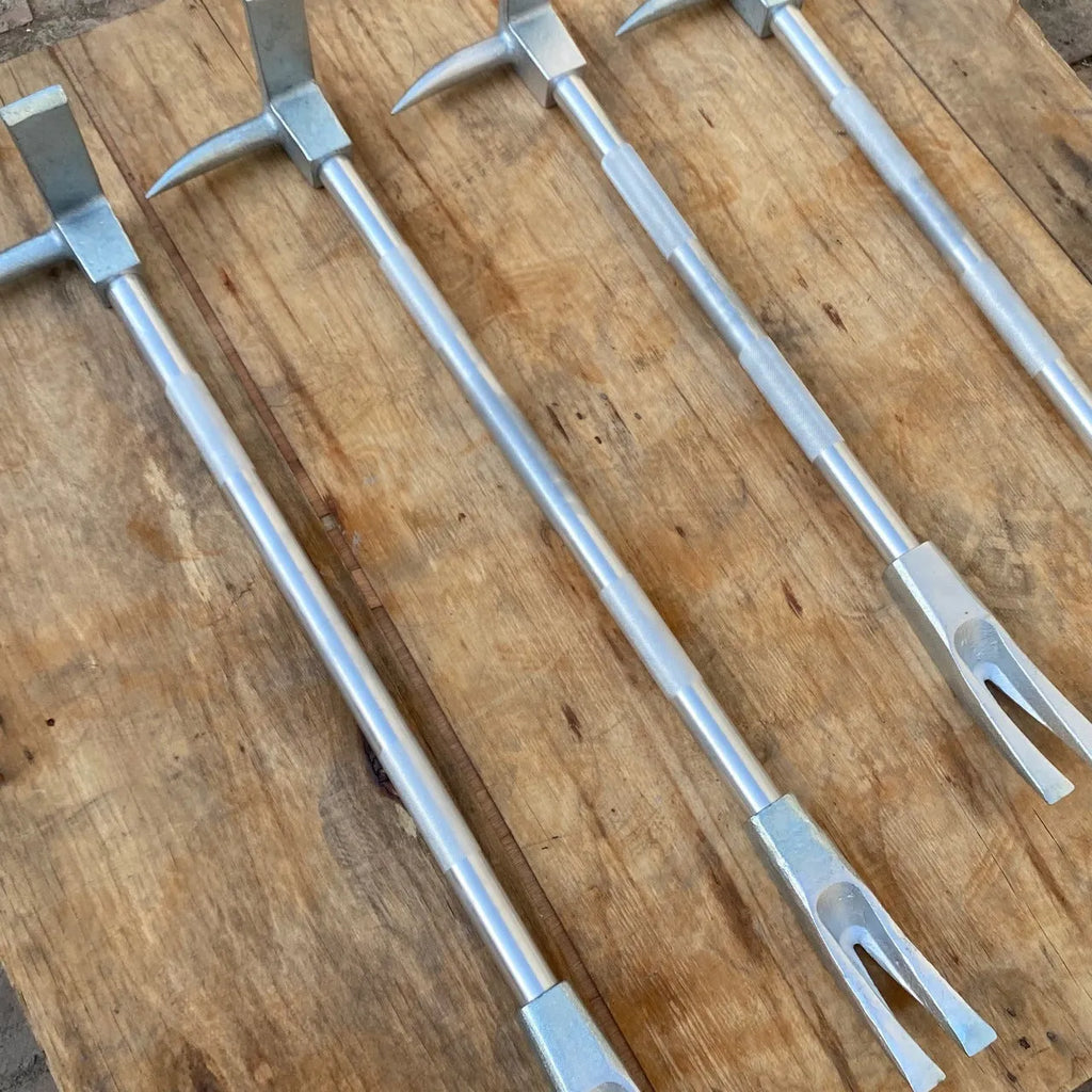 Silver carbon steel wrecking bar 24 inches 61cm multifunctional fire breaking tool on plain background
