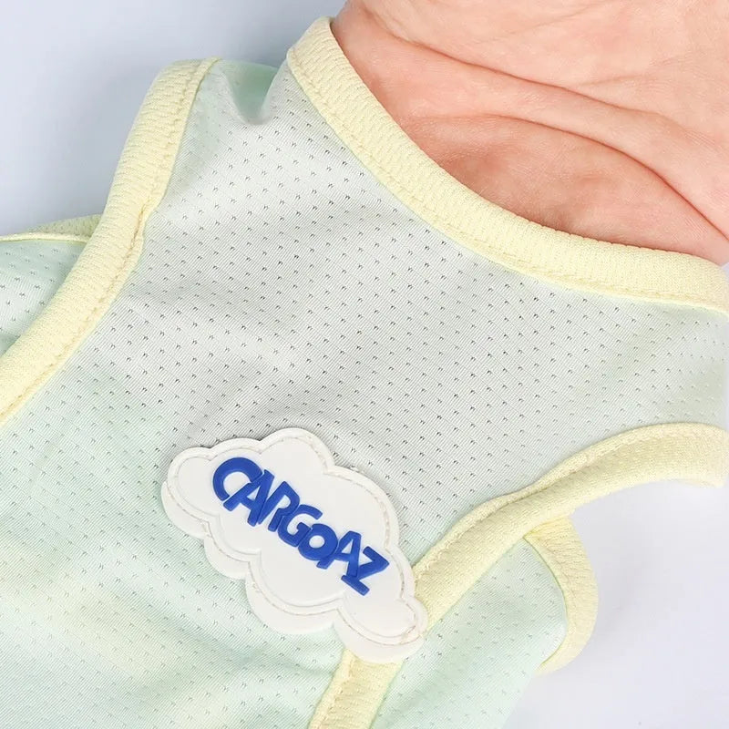 Grass green lightweight polyester vest for cats on a grey background, showing front hook-and-loop closure.