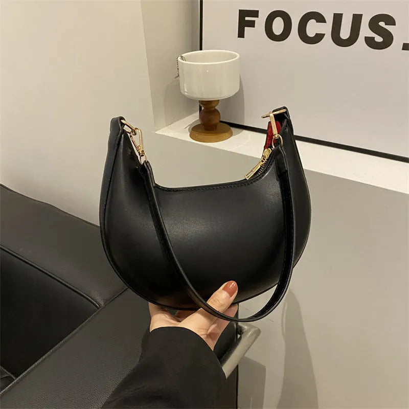 Round green PU leather one-shoulder underarm bag with sewing line details and a shoulder strap