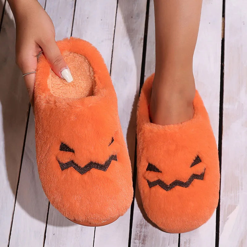 Orange coral velvet plush slippers with a non-slip PVC sole and fluffy lining.