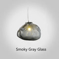 Modern light luxury glass chandelier in amber, clear, and smoke grey colours for lounge lighting.