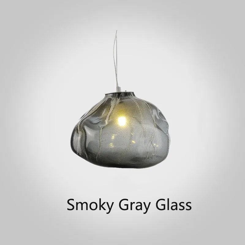 Modern light luxury glass chandelier in amber, clear, and smoke grey colours for lounge lighting.