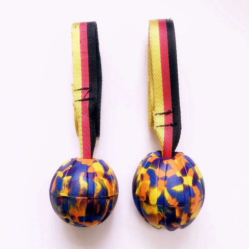 EVA floating pet training ball in camouflage colour showing tetherball design with knot attachment