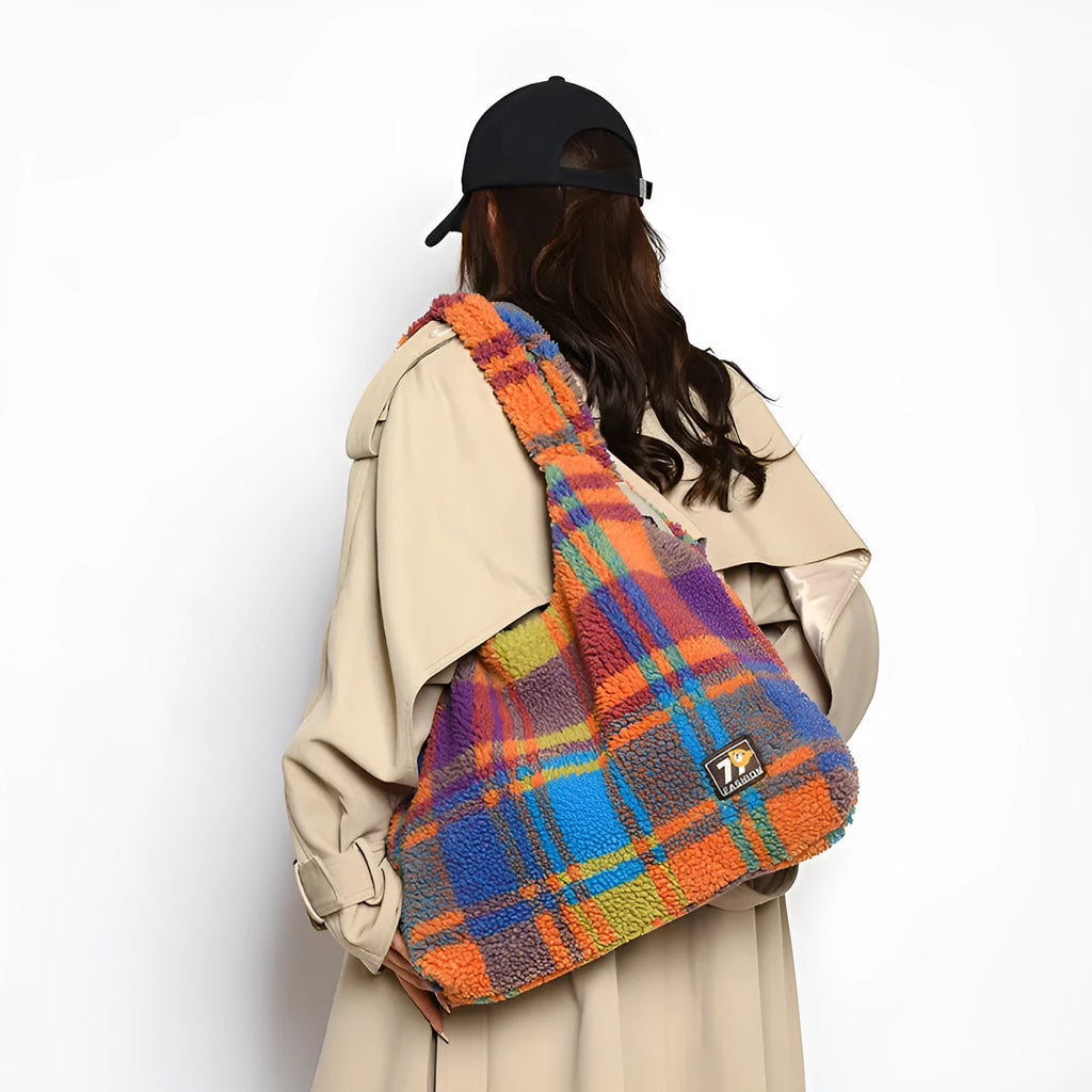 Women's plaid pattern plush crossbody tote bag showing interior zipper compartment and strap design