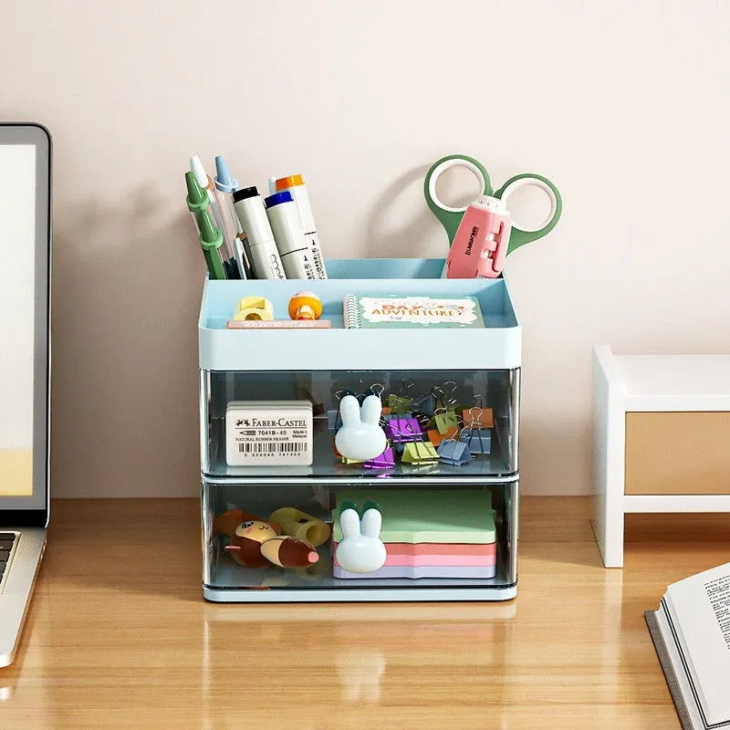 Transparent plastic desktop storage box with internal grid partitions, shown in pink colour.