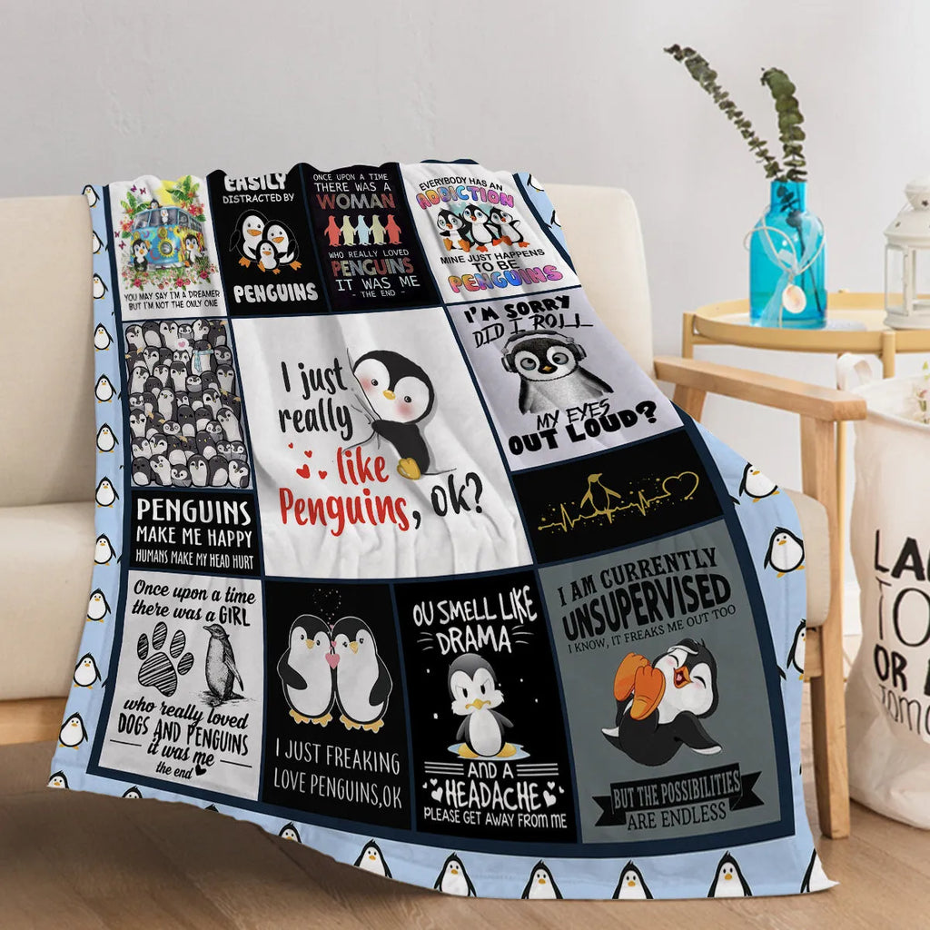 Multicoloured penguin flannel velvet throw blanket on sofa with hemmed edges