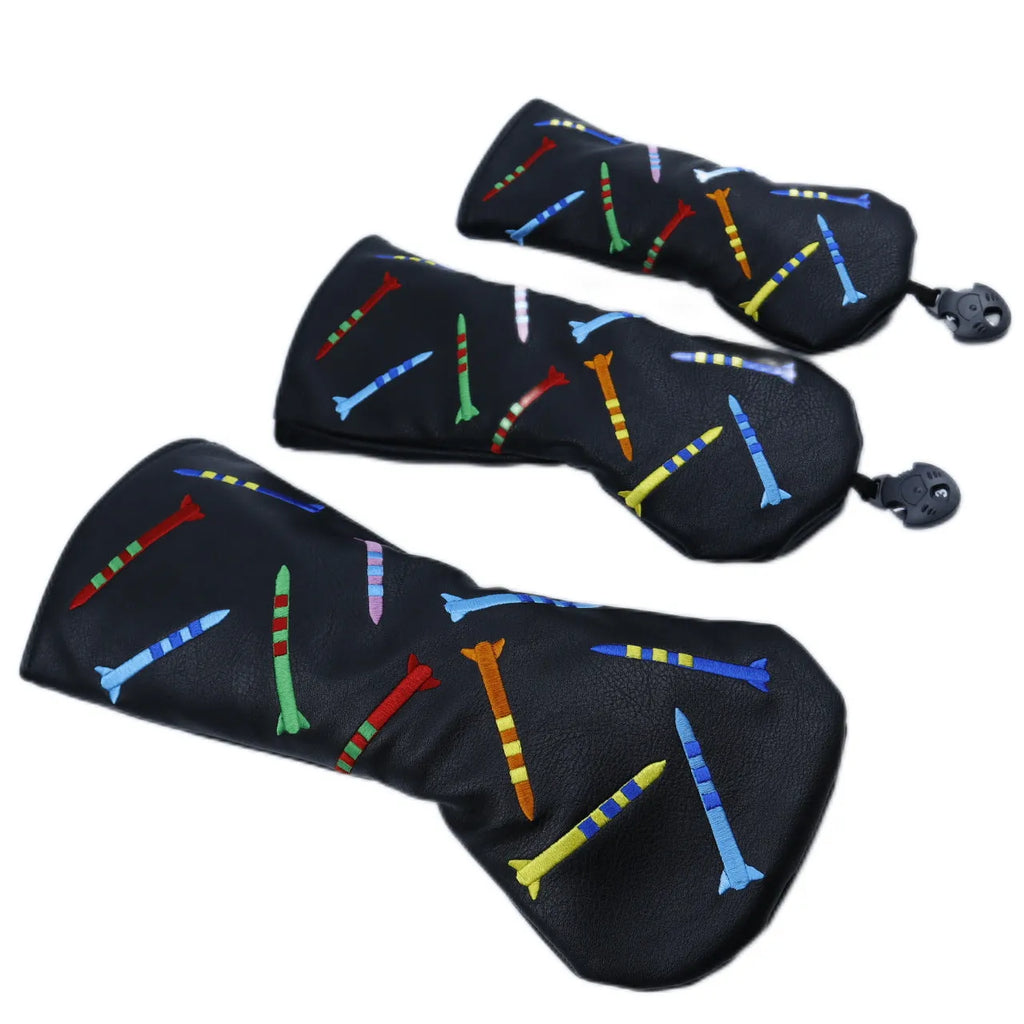 Set of three black golf putting practice clubs in large, medium, and small sizes on a green.