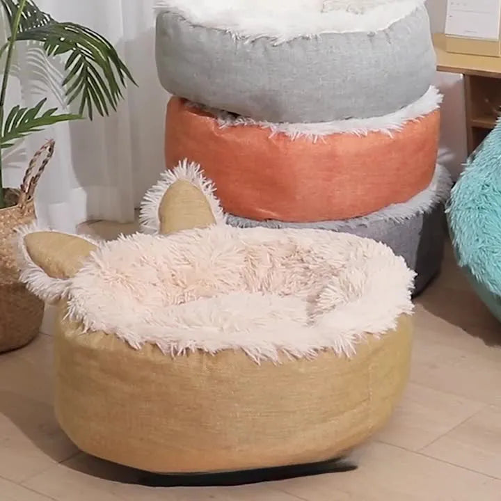 Plush faux fur circular pet bed for cats and small dogs in blue colour showing soft textured material