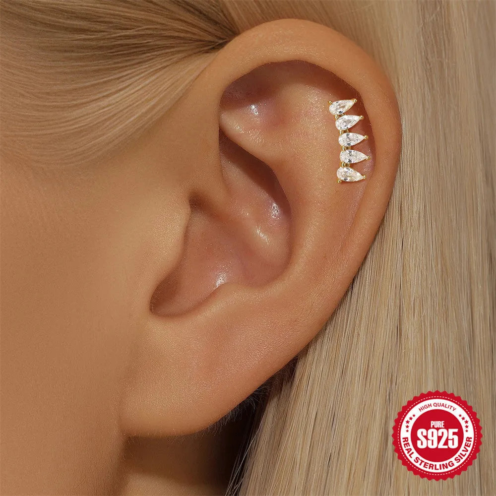 S925 sterling silver geometric moon and star earrings with diamond accents on a gold-coloured background.