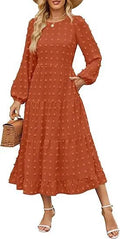 A beige high-waisted long sleeve dress with ruffled sleeves on a hanger.