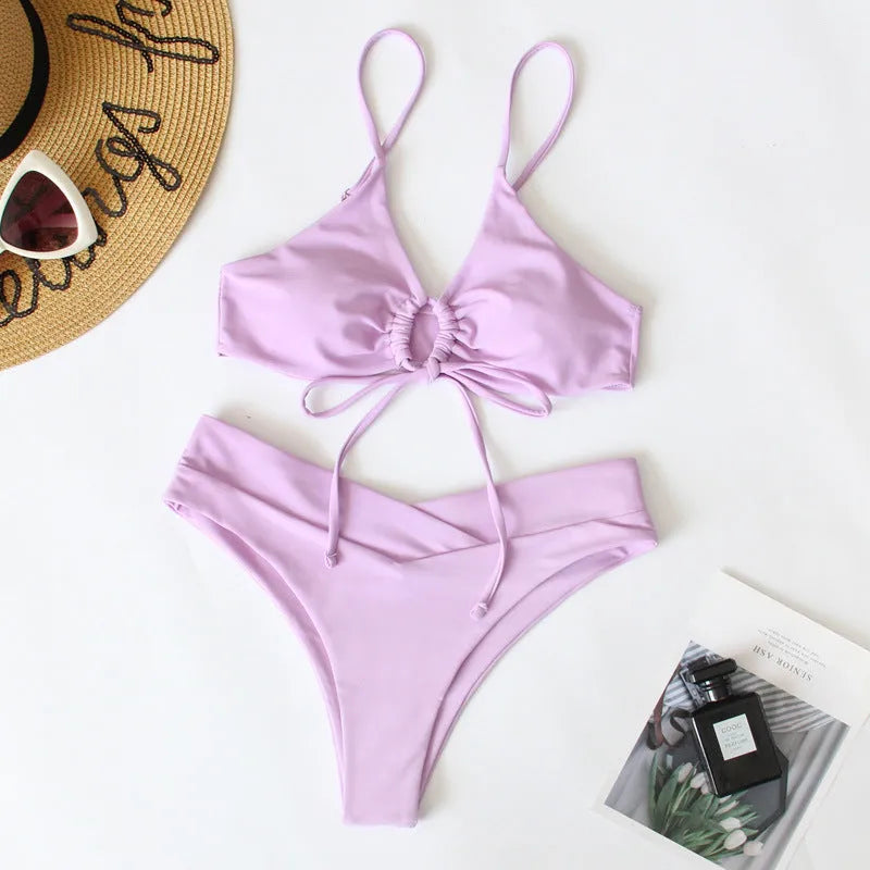 Women's orange tied bow split front bikini with briefs bottoms, shown on a mannequin.