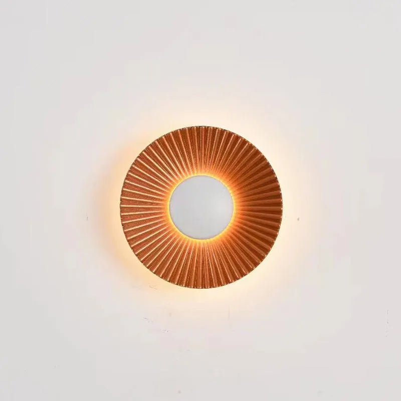 Round wall-mounted LED light with aluminium shade in a gold and white two-tone colour option.