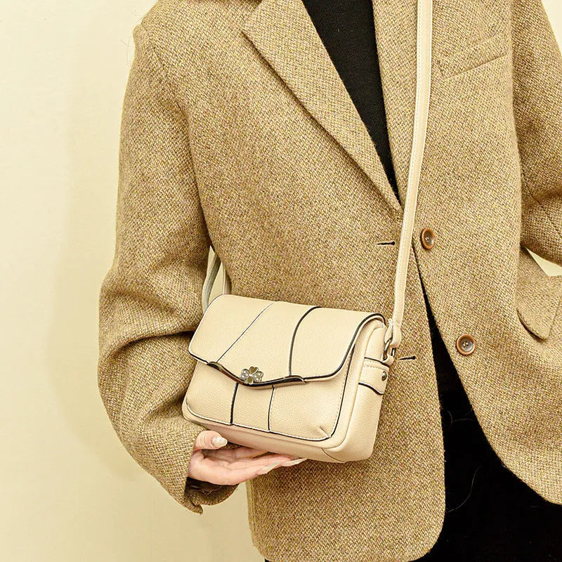 Round PU patchwork crossbody bag in beige with single shoulder strap and multiple internal pockets