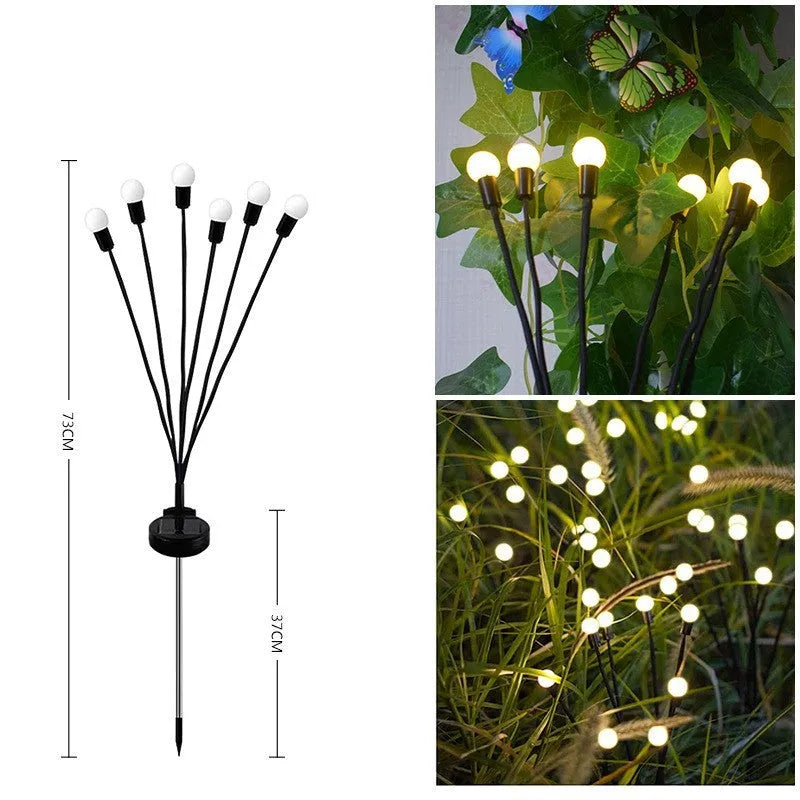 Solar-powered LED garden stake light with automatic sensor, shown pushed into soil beside plants.