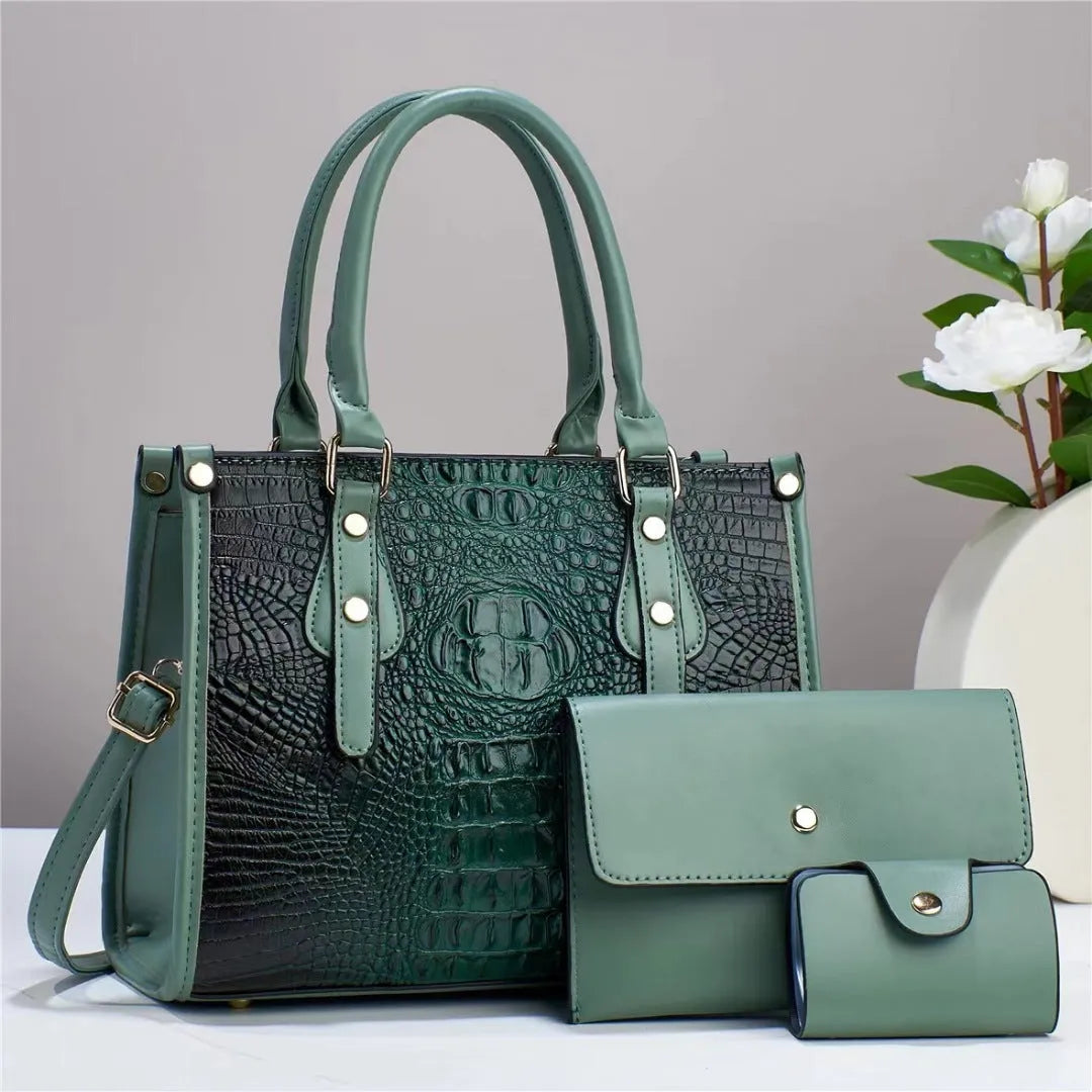 Women's burgundy PU leather bucket crossbody bag set with matching wallet and card bag.