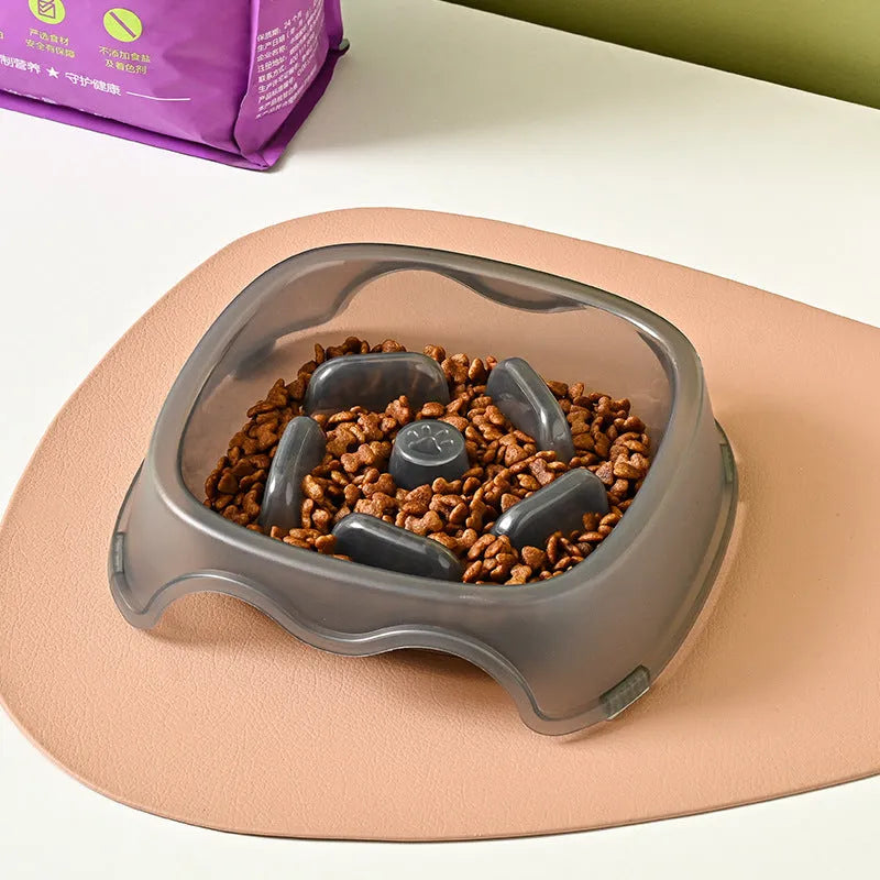 Blue plastic dog slow feeder anti-choking bowl on a white background.