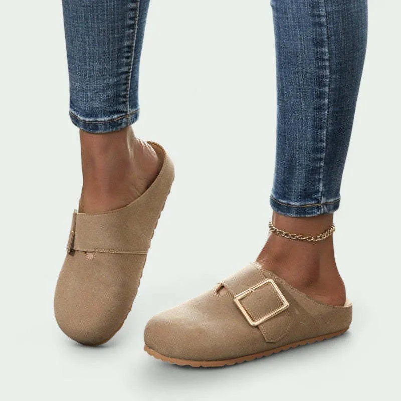Women's brown canvas slippers with closed toe and low top design