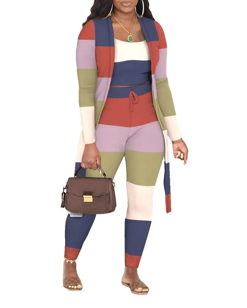 Women's multicolour plaid three-piece set with long sleeve coat, vest and trousers on model