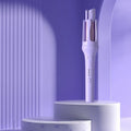 White and pink automatic hair curler with a rotating 32mm ceramic barrel and international plug adapters.