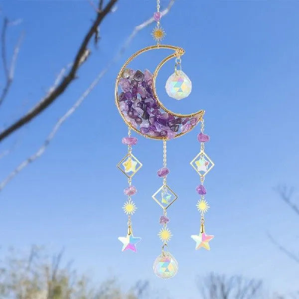 Moon-shaped K9 crystal car pendant on a metal base with a hanging chain.