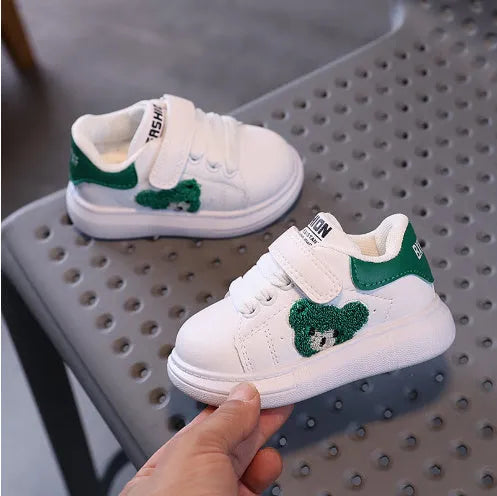 Baby Bear cartoon pattern kids sports sneakers in black, green, and khaki on a white background.