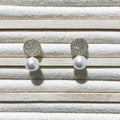 Round diamond studded pearl earrings in gold finish with post back closure