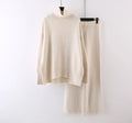 Women's milky white acrylic knit two-piece set featuring a long-sleeve sweater and wide-leg trousers on a hanger.