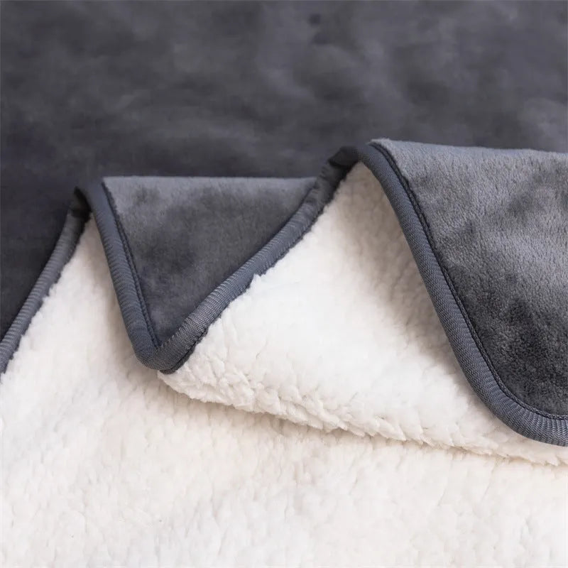 Lambswool waterproof dog blanket in grey, folded to show size and cloth texture.