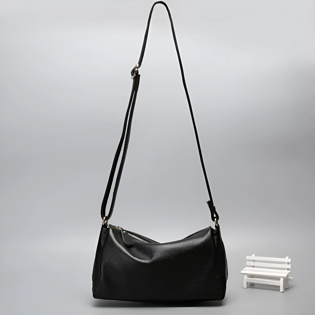 A soft genuine leather women's crossbody bag in a horizontal square shape, shown in one of four available colours.