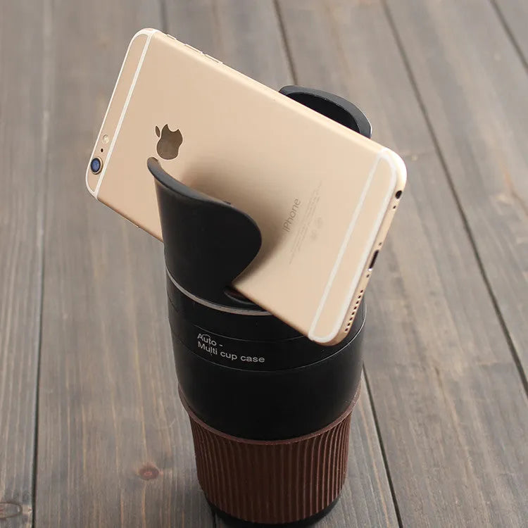 Black multifunction car cup holder with attached navigation phone mount bracket.