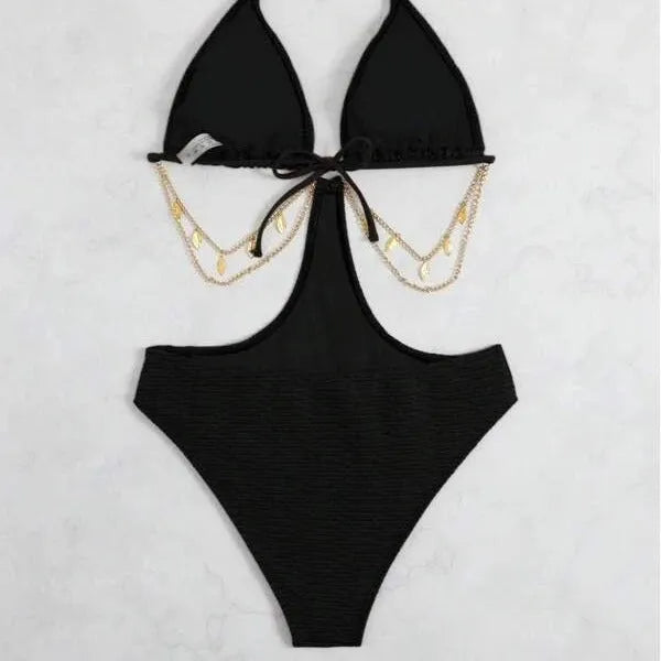 Women's black bikini swimsuit with silver chain detail on a mannequin