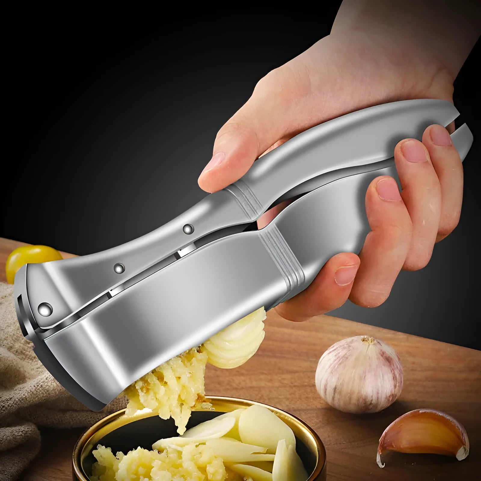 Silver aluminium alloy manual garlic press 20cm long on a white background