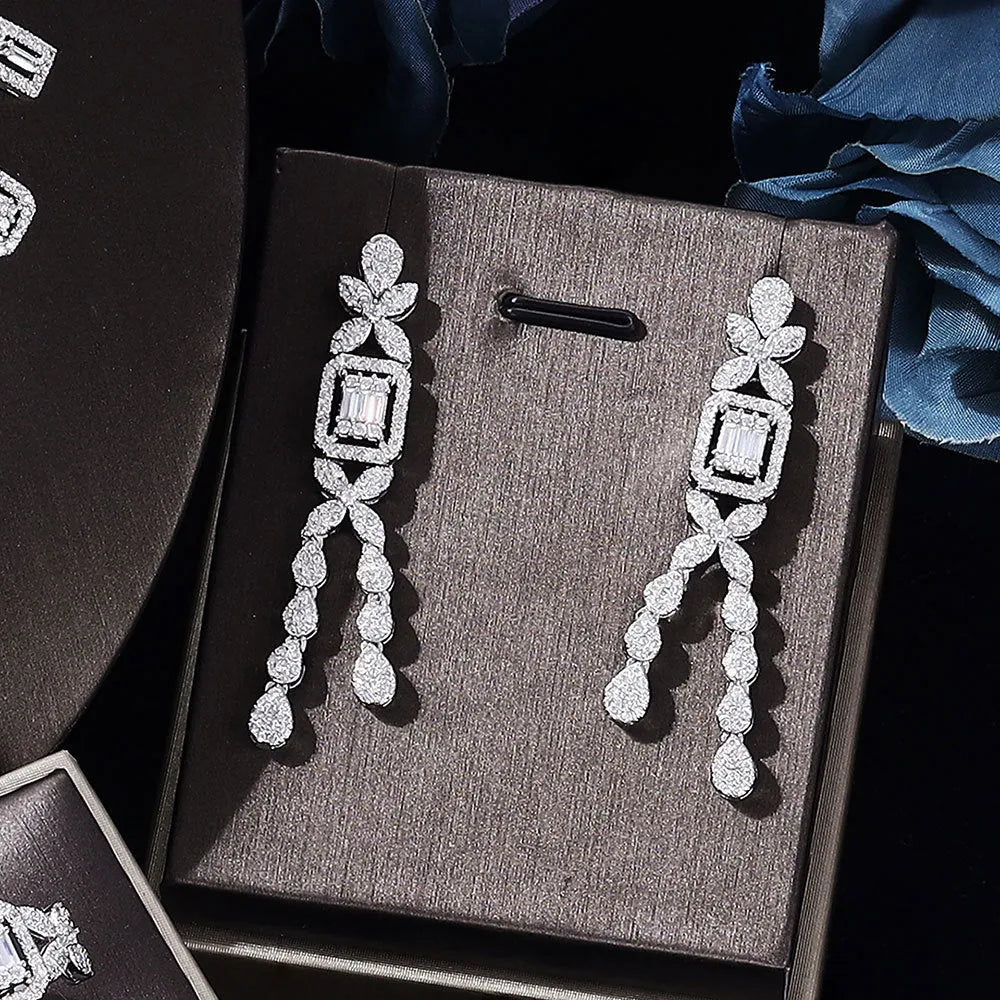 White copper inlaid zircon four piece jewellery set with love heart, water drop, and bell patterns including necklace, earrings, bracelet, and ring