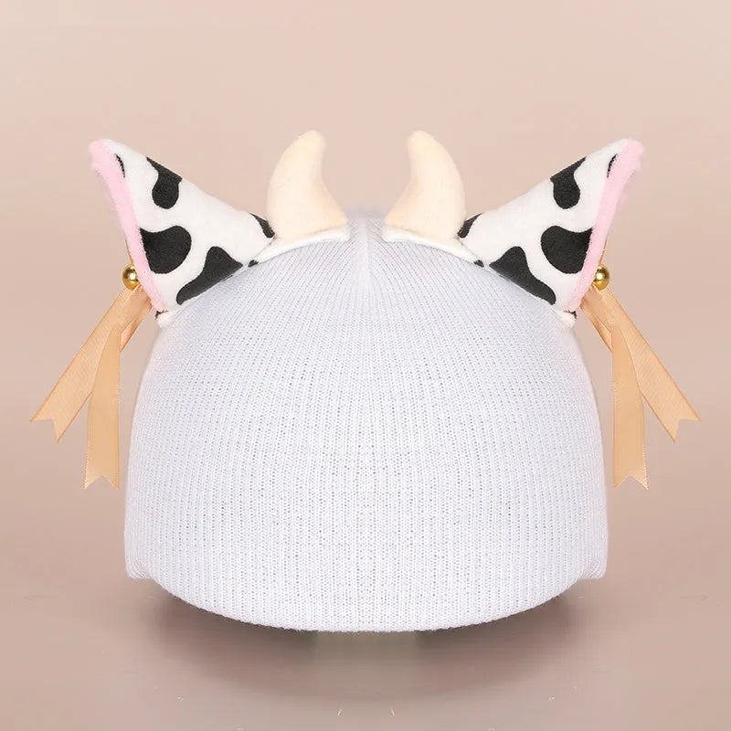 A soft plush cartoon character cover stretched over a medium-sized motorcycle helmet.