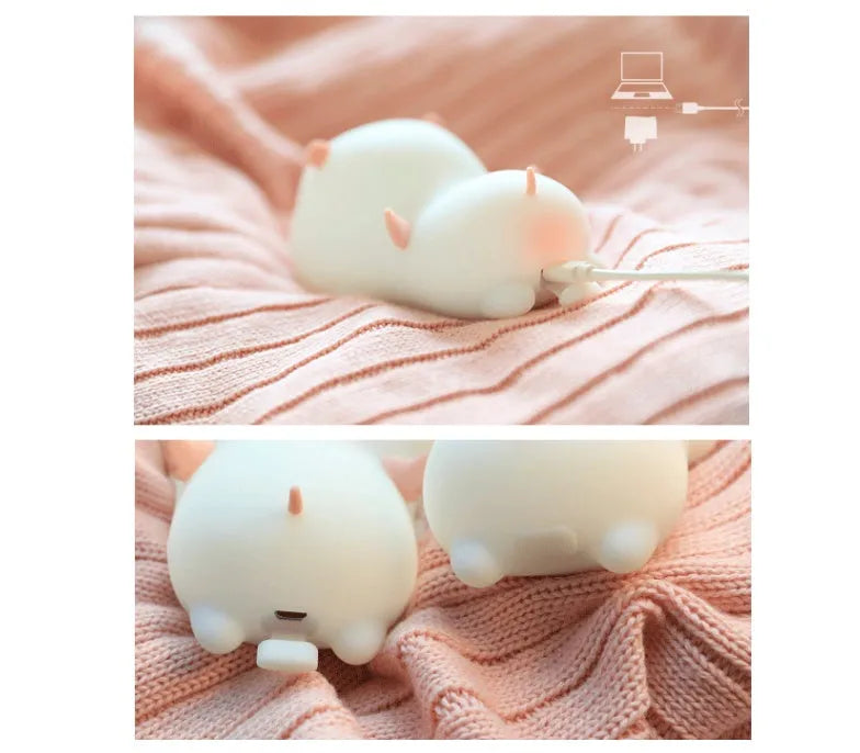 Blue silicone pig night light with sleeping expression and rechargeable battery