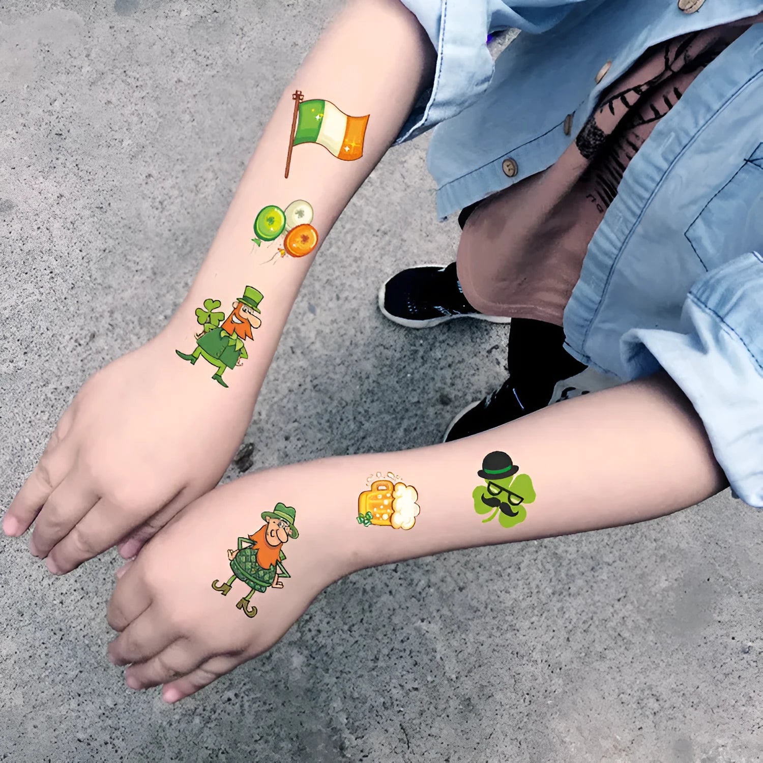 St. Patrick's Day green clover temporary tattoo sticker on paper sheet for children's faces.