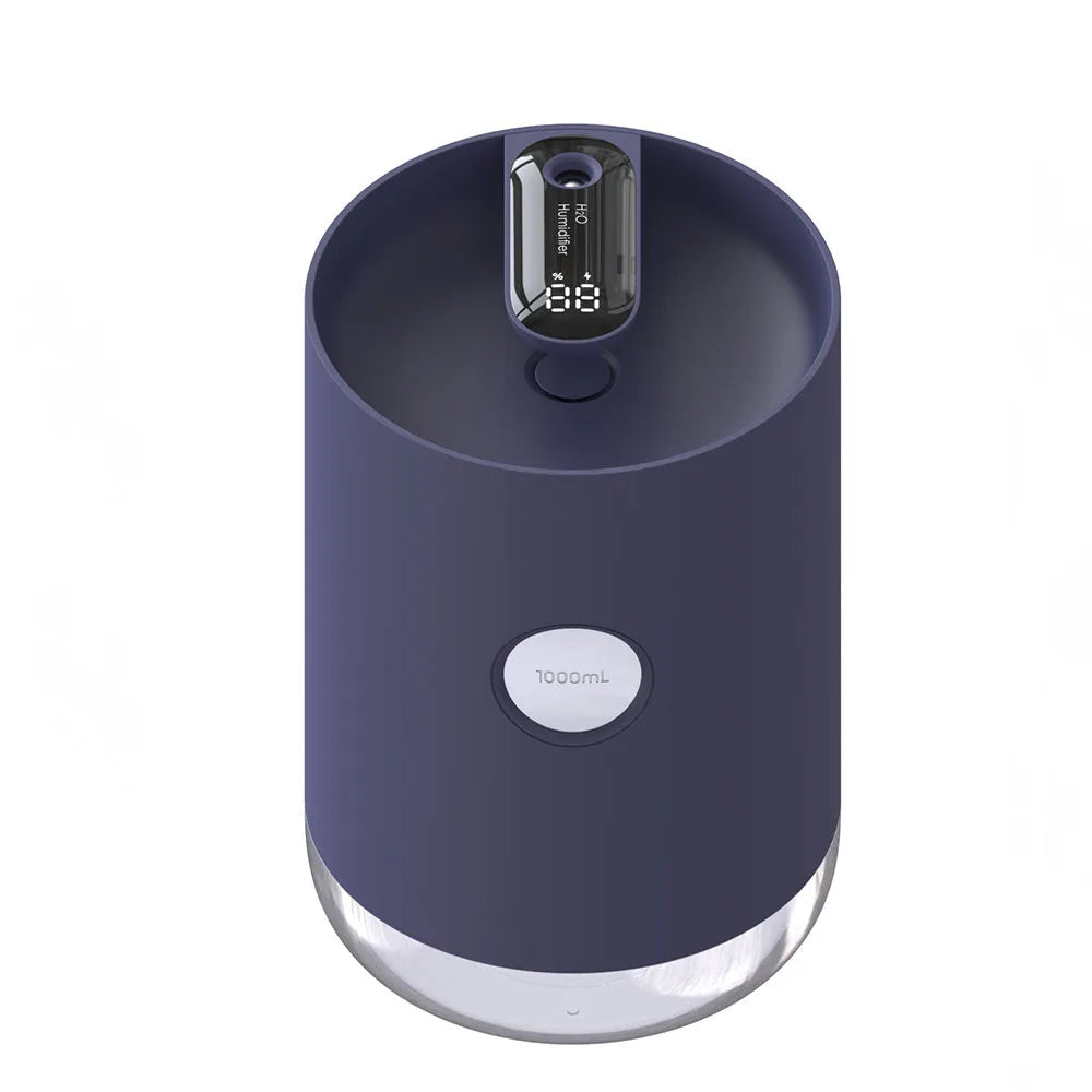 Blue wireless USB humidifier with water tank on a wooden desk next to a plant.