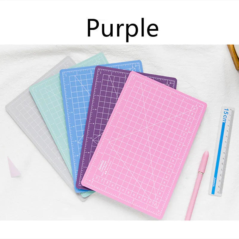 Art pen knife cutting board set in blue with backing board, ruler, pen sharpener and blade.