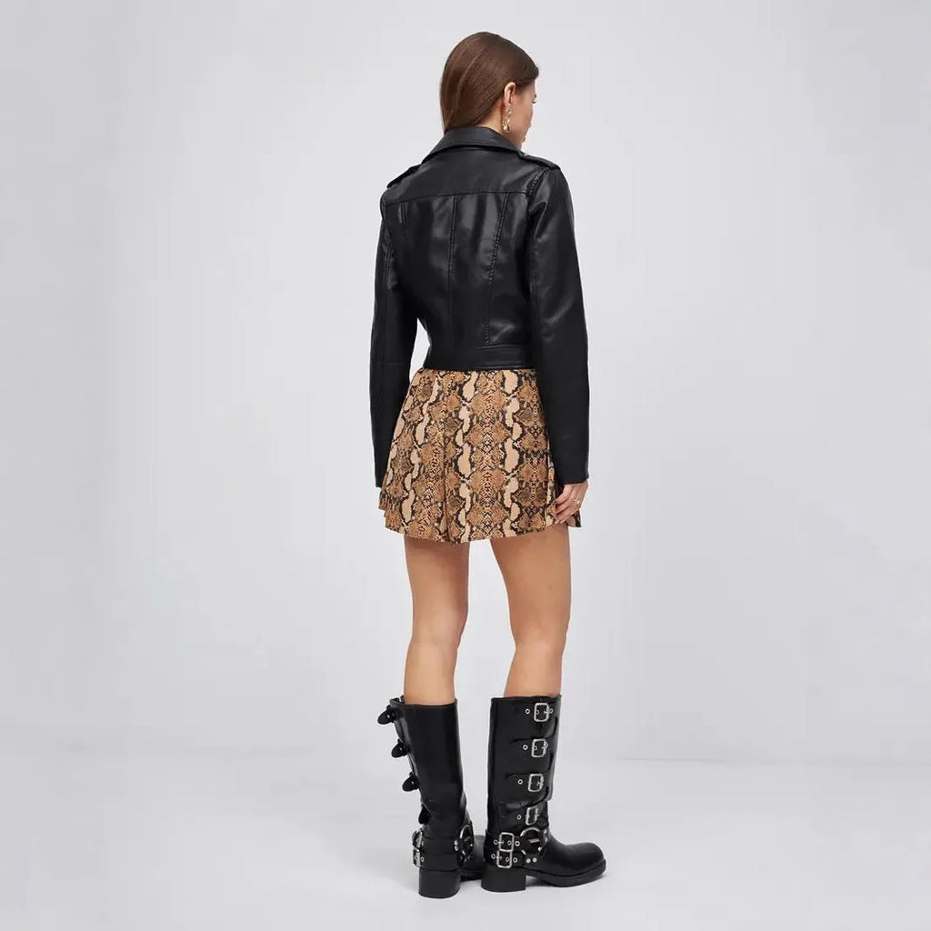 Black women's retro locomotive style jacket made from PU imitation leather on a model.