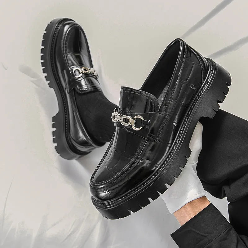 Men's crocodile print platform loafers in black, brown and yellow colours showing textured leather and flat heel design