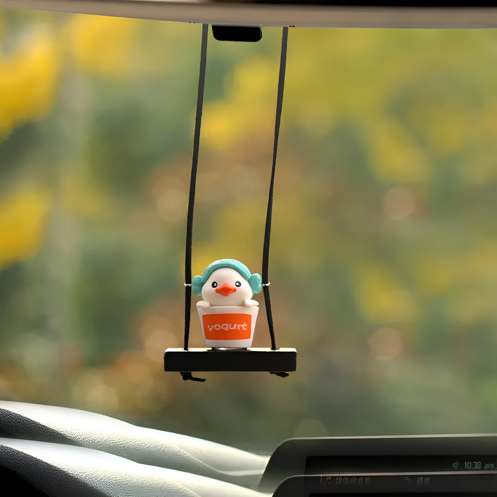 Yellow plastic duck car hanging ornament in four cartoon design styles.