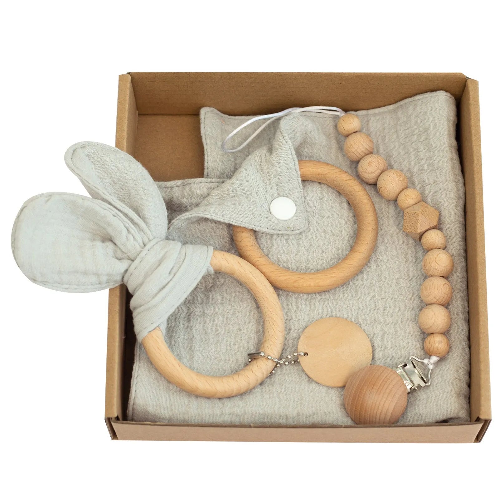 Baby teething toy gift set showing gauze blanket, wooden bell, gum teether, tire brush, and milestone on white background