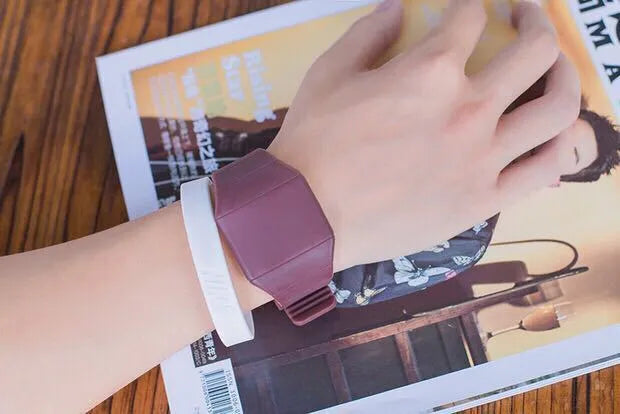 Square electronic watch with touch screen on wrist in multiple colour options