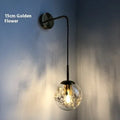 Modern simple glass wall bedside lamp in Golden Flower or Silver Flower finish, 15cm or 20cm size.