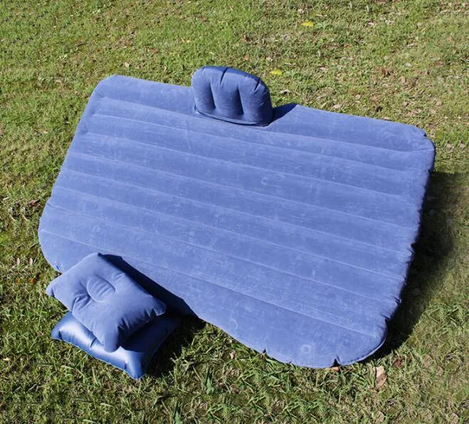 Black thickened flocking inflatable car bed set up in a vehicle with pillows.