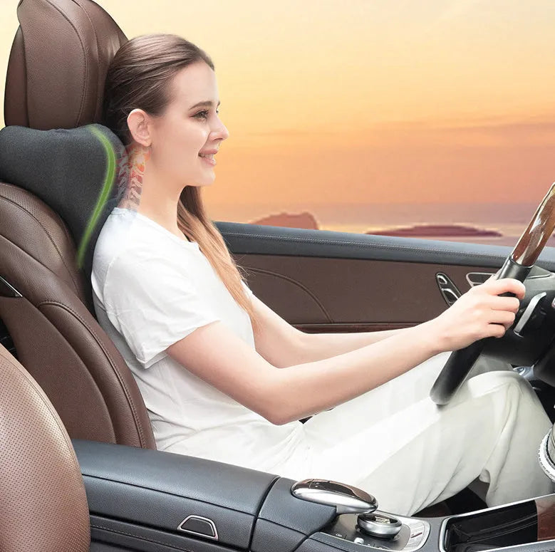 Solid-colour car neck memory pillow in dark grey, shown on a car headrest.