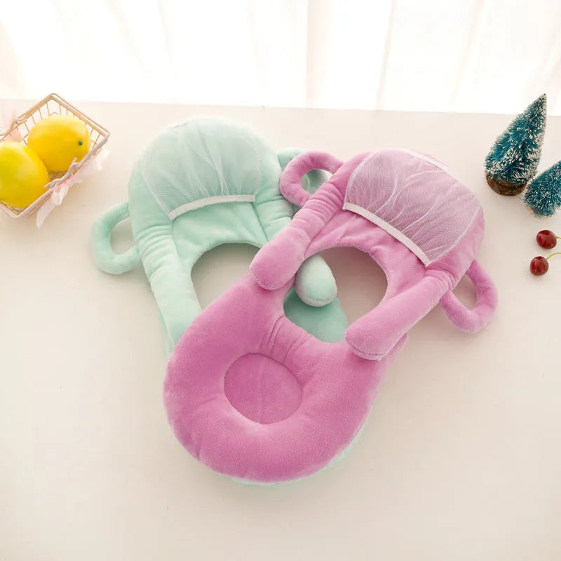 Plush confinement baby feeding pillow in soft colours, measuring 30cm by 42cm.