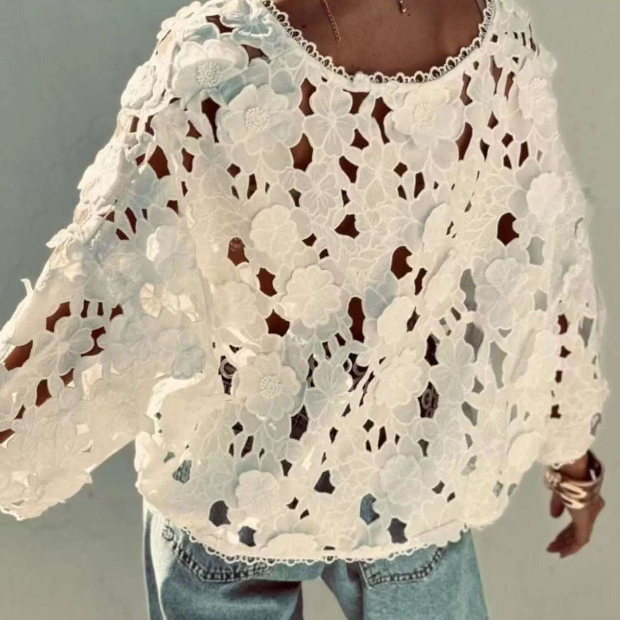 Black loose fit cardigan with white 3D lace floral decoration and a V-neckline