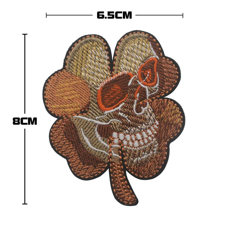 Embroidered fabric badge with Velcro backing showing camo pattern in green colour